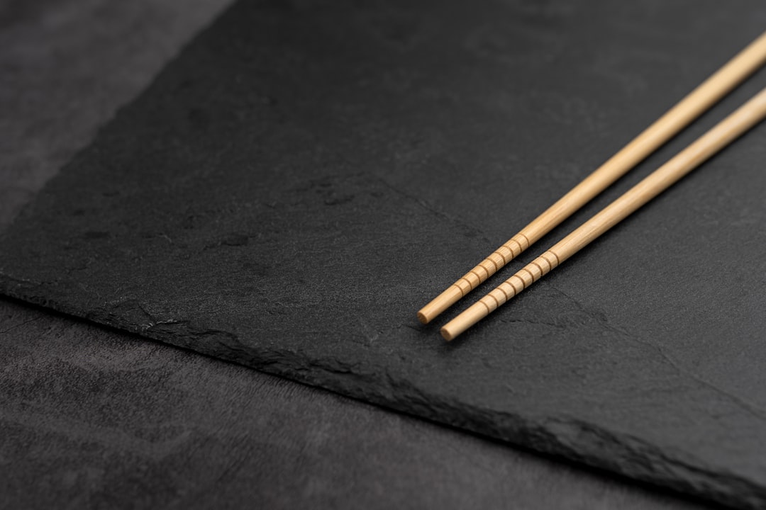 Wooden chopsticks on a dark cloth