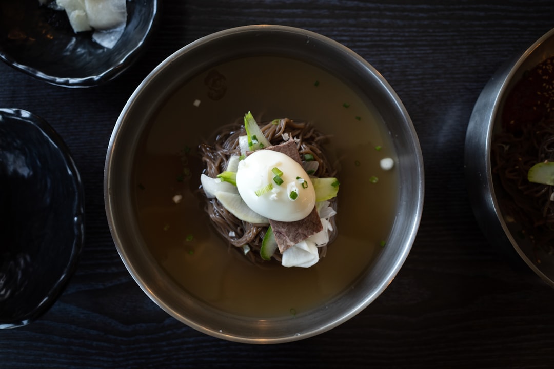 A bowl of miyeokguk (Korean seaweed soup) with dark wakame seaweed floating in clear broth