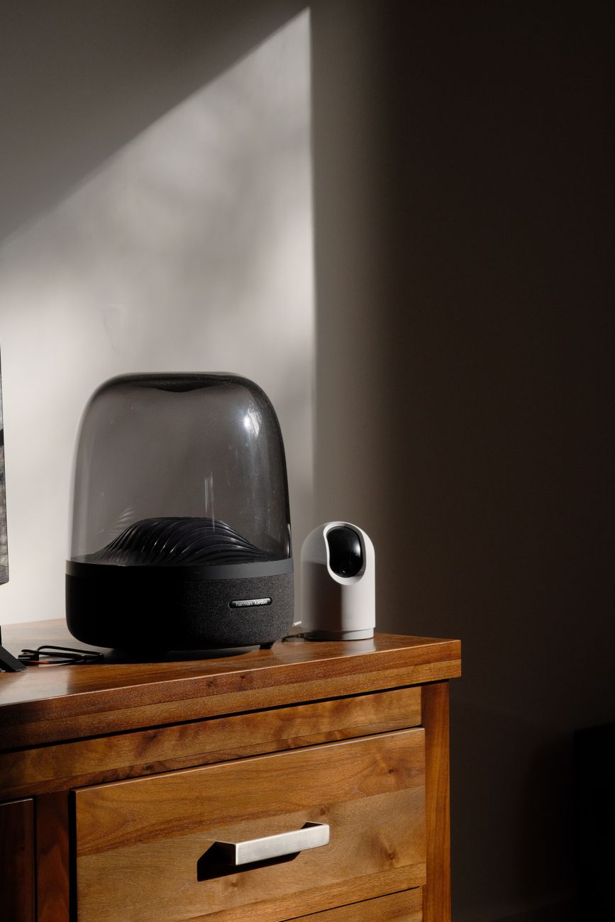 White noise machine positioned safely on dresser across room from crib